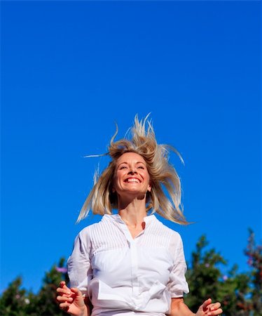 simsearch:400-04450996,k - Happy young woman jumping in a park Stock Photo - Budget Royalty-Free & Subscription, Code: 400-04614595