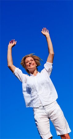 simsearch:400-04450996,k - Happy young woman jumping in a park Stock Photo - Budget Royalty-Free & Subscription, Code: 400-04614597