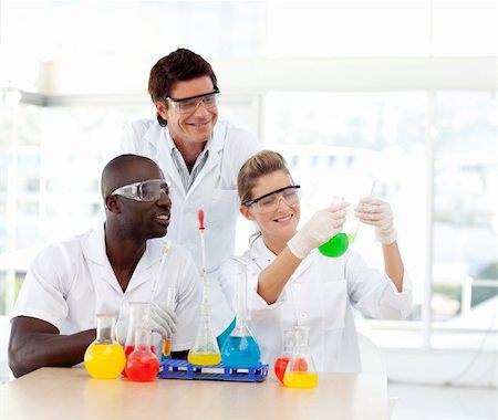 simsearch:400-07091851,k - Multi-ethnic scientists examining a test-tube Stock Photo - Budget Royalty-Free & Subscription, Code: 400-04614650