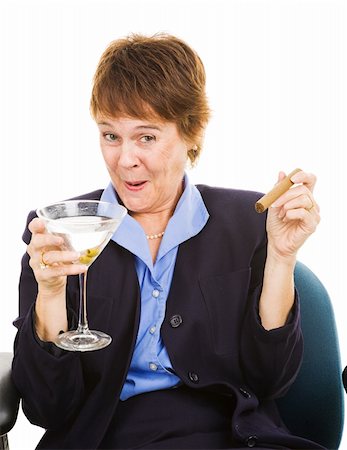 Businesswoman getting drunk at work on a martini, while smoking a cigar. Stock Photo - Budget Royalty-Free & Subscription, Code: 400-04614669