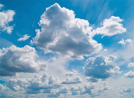 Backlit white clouds on a bright blue summer sky Foto de stock - Super Valor sin royalties y Suscripción, Código: 400-04614731