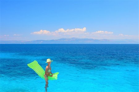 Beautiful young woman enjoying the Ionian sea in Greece Stock Photo - Budget Royalty-Free & Subscription, Code: 400-04614743