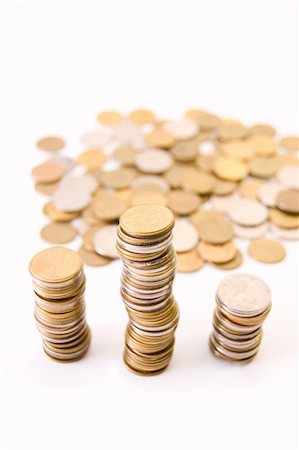 piles of cash pounds - Coins isolated on white background Photographie de stock - Aubaine LD & Abonnement, Code: 400-04614876