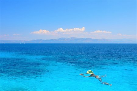 Beautiful young woman enjoying the Ionian sea in Greece Stock Photo - Budget Royalty-Free & Subscription, Code: 400-04615055