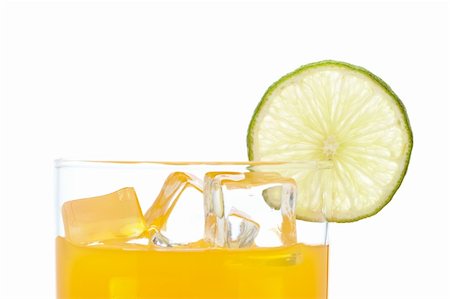 simsearch:400-04046933,k - A glass of orange juice with a lime slice , isolated on white background Foto de stock - Super Valor sin royalties y Suscripción, Código: 400-04615613