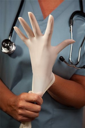 simsearch:400-05060422,k - Abstract Image of Doctor Putting on Latex Surgical Gloves. Stock Photo - Budget Royalty-Free & Subscription, Code: 400-04615666