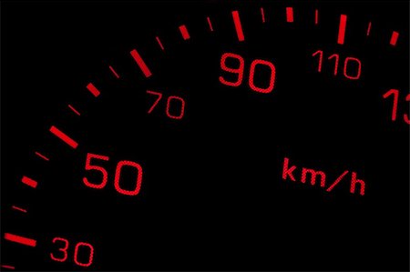 simsearch:400-07299922,k - Orange neon speedometer over a black background. Shallow depth of field Stockbilder - Microstock & Abonnement, Bildnummer: 400-04615991