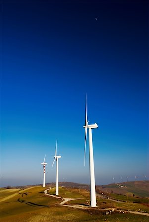 Three modern and ecologic generators on top of a hill Foto de stock - Super Valor sin royalties y Suscripción, Código: 400-04616259