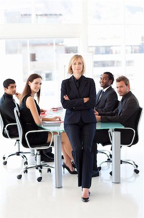 simsearch:400-04918393,k - Serious businesswoman looking at the camera with folded arms in a meeting Stock Photo - Budget Royalty-Free & Subscription, Code: 400-04616482