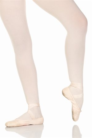 simsearch:400-05147643,k - Young caucasian ballerina girl on white background and reflective white floor showing various ballet steps and positions. Not Isolated Stock Photo - Budget Royalty-Free & Subscription, Code: 400-04616548