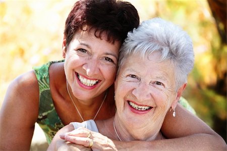 close-up portrait of a beautiful senior mother and daughter smiling at the camera Stock Photo - Budget Royalty-Free & Subscription, Code: 400-04616688