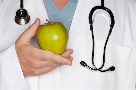 simsearch:400-05192323,k - Male Doctor with Stethoscope Holding Green Apple. Stock Photo - Budget Royalty-Free & Subscription, Code: 400-04616937