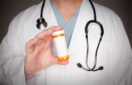 pill bottle in hand - Male Doctor with Stethoscope and Blank Medicine Bottle. Stock Photo - Budget Royalty-Free & Subscription, Code: 400-04616930