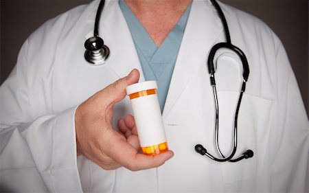 Male Doctor with Stethoscope and Blank Medicine Bottle. Stockbilder - Microstock & Abonnement, Bildnummer: 400-04616932