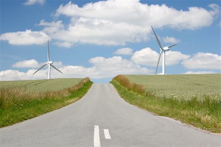 simsearch:400-04465410,k - The road to green energy. Countryside road in Jutland, Denmark among windmills and wheat fields. Stock Photo - Budget Royalty-Free & Subscription, Code: 400-04617209