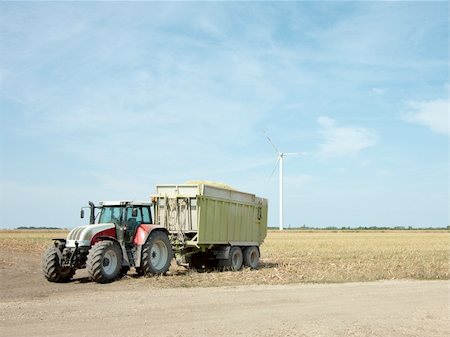 simsearch:400-05244668,k - Agricultural field with tractor after harvest Stock Photo - Budget Royalty-Free & Subscription, Code: 400-04617296