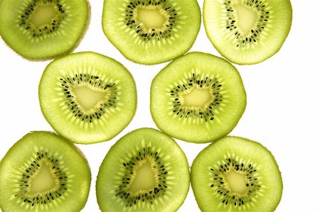 simsearch:400-04553701,k - Kiwi green transparent slices over white background Stock Photo - Budget Royalty-Free & Subscription, Code: 400-04617486