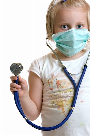 Little child plays doctor with stethoscope and mask Stock Photo - Budget Royalty-Free & Subscription, Code: 400-04617740