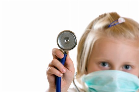 Little child plays doctor with stethoscope and mask Stock Photo - Budget Royalty-Free & Subscription, Code: 400-04617741