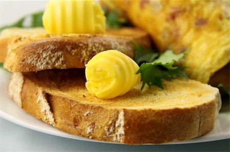 simsearch:400-05255035,k - Scroll of butter on fresh toast ready to serve. Stock Photo - Budget Royalty-Free & Subscription, Code: 400-04617870