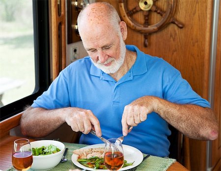 senior man eating table not woman - Senior man enjoys a healthy dinner of turkey, green beans and salad, in his motor home. Stock Photo - Budget Royalty-Free & Subscription, Code: 400-04618004