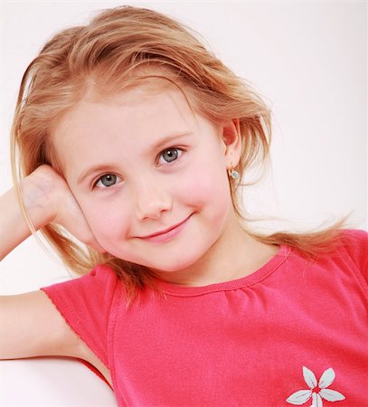 simsearch:400-04161658,k - Beautiful small girl is smiling  sincerely Fotografie stock - Microstock e Abbonamento, Codice: 400-04618441