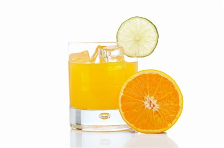 simsearch:400-04046933,k - A glass of orange juice with a lime slice , isolated on white background Foto de stock - Super Valor sin royalties y Suscripción, Código: 400-04619521