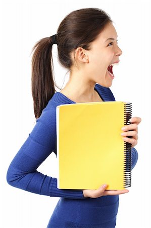 Very excited university student showing blank yellow notebook. Isolated on white. Stock Photo - Budget Royalty-Free & Subscription, Code: 400-04619545