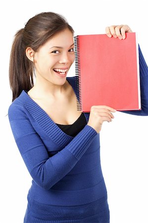 Very happy university student showing blank red notebook. Isolated on white. Stock Photo - Budget Royalty-Free & Subscription, Code: 400-04619546
