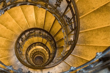 stairs on tunnel - Spiral staircase, forged handrail and stone steps in old tower Stock Photo - Budget Royalty-Free & Subscription, Code: 400-04619643