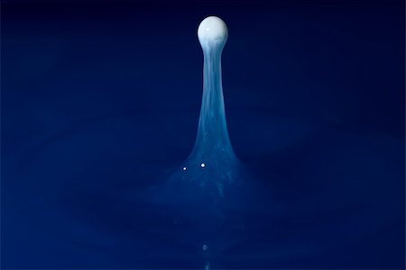 simsearch:628-02953718,k - White droplets falling in blue colered water Stock Photo - Budget Royalty-Free & Subscription, Code: 400-04619729