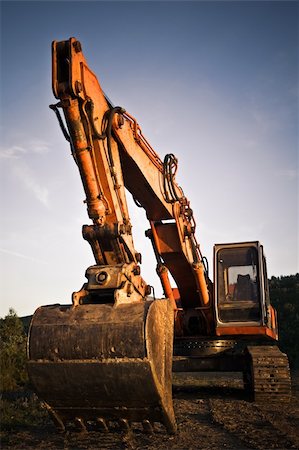 simsearch:400-05111345,k - A big orange excavator at construction site Fotografie stock - Microstock e Abbonamento, Codice: 400-04610334