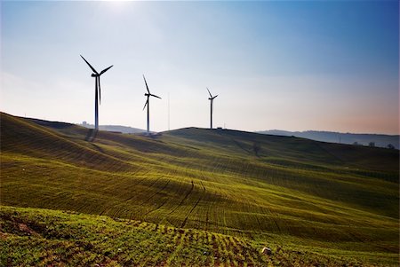 simsearch:400-05877544,k - Three wind turbines silhouettes on top of hill Stock Photo - Budget Royalty-Free & Subscription, Code: 400-04610349