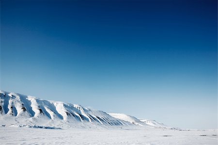 simsearch:6119-07968983,k - A winter mountain landscape of the island of Spitsbergen, Svalbard, Norway Stock Photo - Budget Royalty-Free & Subscription, Code: 400-04610497