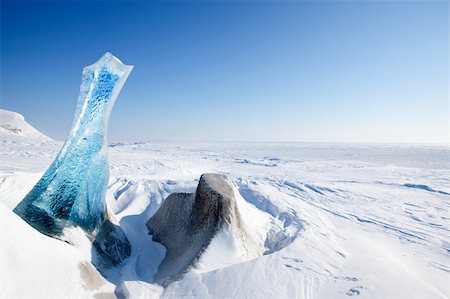 simsearch:400-05140080,k - A piece of glacial ice sticking out of the frozen ocean, Spitsbergen, Svalbard, Norway Fotografie stock - Microstock e Abbonamento, Codice: 400-04610557