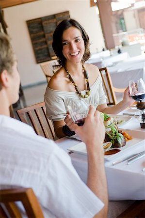 eastwestimaging (artist) - A young woman having dinner with a male partner Fotografie stock - Microstock e Abbonamento, Codice: 400-04610624