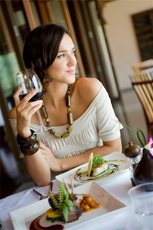 eastwestimaging (artist) - A young woman enjoying a meal and wine Foto de stock - Super Valor sin royalties y Suscripción, Código: 400-04610625