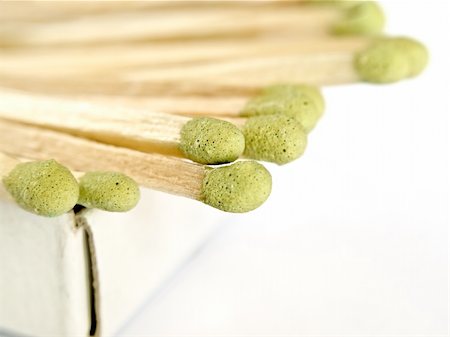 matches sticking out of the matchbox, macro shot over white background with copy space, shallow DOF Stock Photo - Budget Royalty-Free & Subscription, Code: 400-04611009