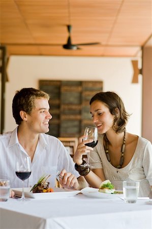 eastwestimaging (artist) - A young couple sitting together in a restaurant Fotografie stock - Microstock e Abbonamento, Codice: 400-04611278