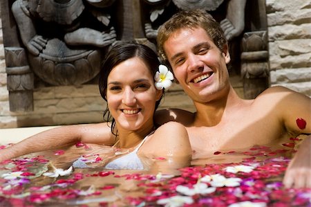 A young couple together in a bath with petals and flowers at a tropical spa Stock Photo - Budget Royalty-Free & Subscription, Code: 400-04611323