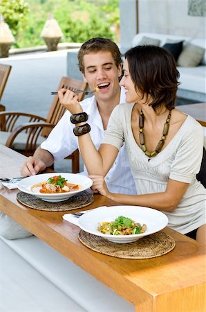 A young couple on vacation eating lunch at a relaxed outdoor restaurant Stock Photo - Budget Royalty-Free & Subscription, Code: 400-04611357