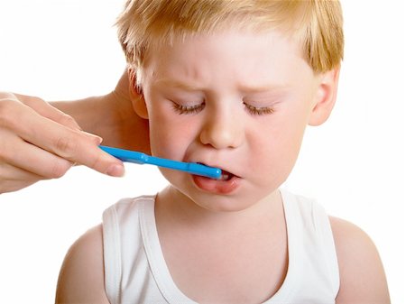 a beautiful little boy cleans your teeth on a white background Stock Photo - Budget Royalty-Free & Subscription, Code: 400-04612059