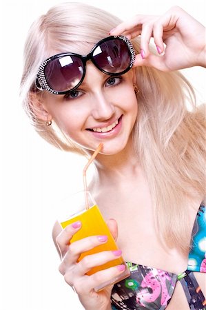 simsearch:400-07625279,k - beautiful women in swimsuit with a glass of juice on a white background isolated Stock Photo - Budget Royalty-Free & Subscription, Code: 400-04612555
