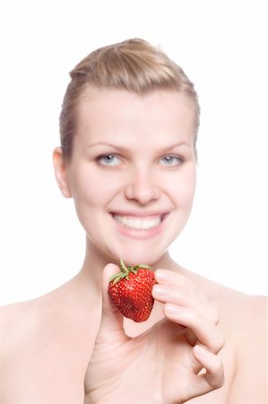 simsearch:400-04513818,k - beautiful blonde girl with a strawberry in the hand looks happy Stock Photo - Budget Royalty-Free & Subscription, Code: 400-04612585