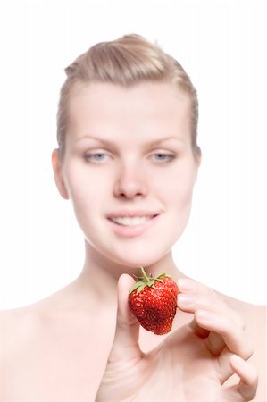 simsearch:400-04513818,k - beautiful blonde girl with a strawberry in the hand looks hungry Stock Photo - Budget Royalty-Free & Subscription, Code: 400-04612586