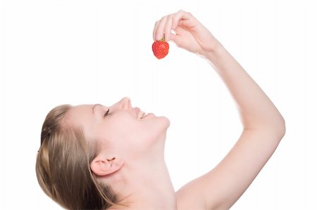 simsearch:400-04513818,k - beautiful blonde girl is going to eat a strawberry Stock Photo - Budget Royalty-Free & Subscription, Code: 400-04612587