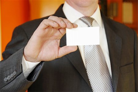 simsearch:400-05694035,k - businessman hand holding and showing blank business card Stock Photo - Budget Royalty-Free & Subscription, Code: 400-04612603