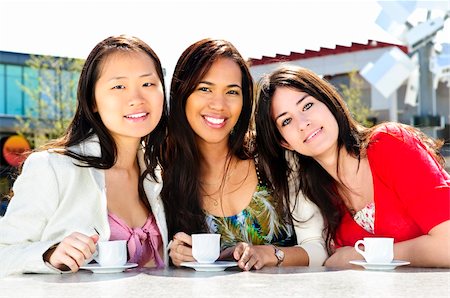 Group of girl friends sitting and having drinks at outdoor cafe Stock Photo - Budget Royalty-Free & Subscription, Code: 400-04612803