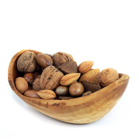 simsearch:400-04181279,k - Nut selection in an olive wood bowl of brazils, walnuts, almonds, pecans and hazelnuts, over white background. Foto de stock - Super Valor sin royalties y Suscripción, Código: 400-04613113