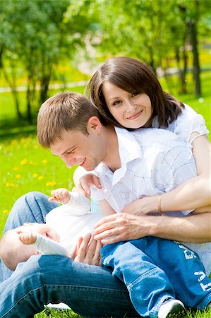 simsearch:400-07715953,k - Mother, father and baby in the park Stock Photo - Budget Royalty-Free & Subscription, Code: 400-04613151